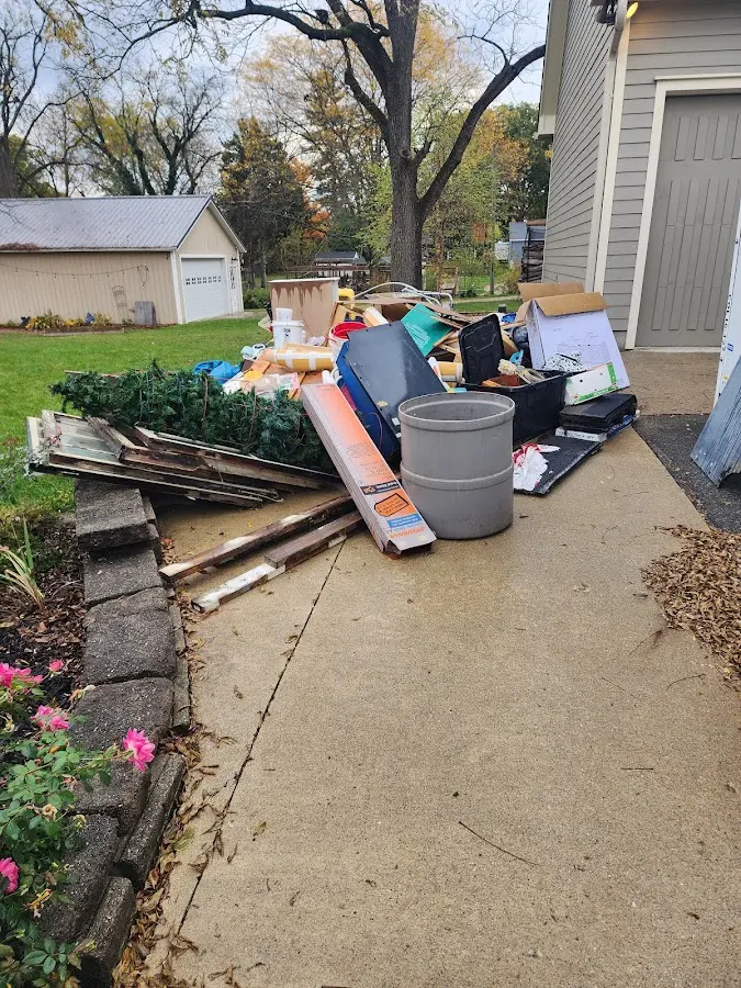 Dumpster being loaded with debris for 30 Yard Dumpster Rental in Kosciusko